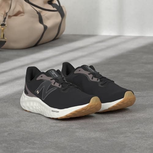 New Balance Women's Fresh Foam Arishi V4 Running Shoe, Black/Light Gold Metallic/Gum 2, 9 Medium US