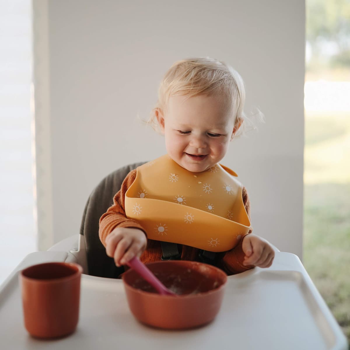 Mushie Baby Silicone Bib | Adjustable Fit Waterproof Bibs | Easy Wipe Baby Feeding Bibs | 4 Adjustable Sizes with Deep Front Pockets | 100% BPA and Phthalate Free — view 6