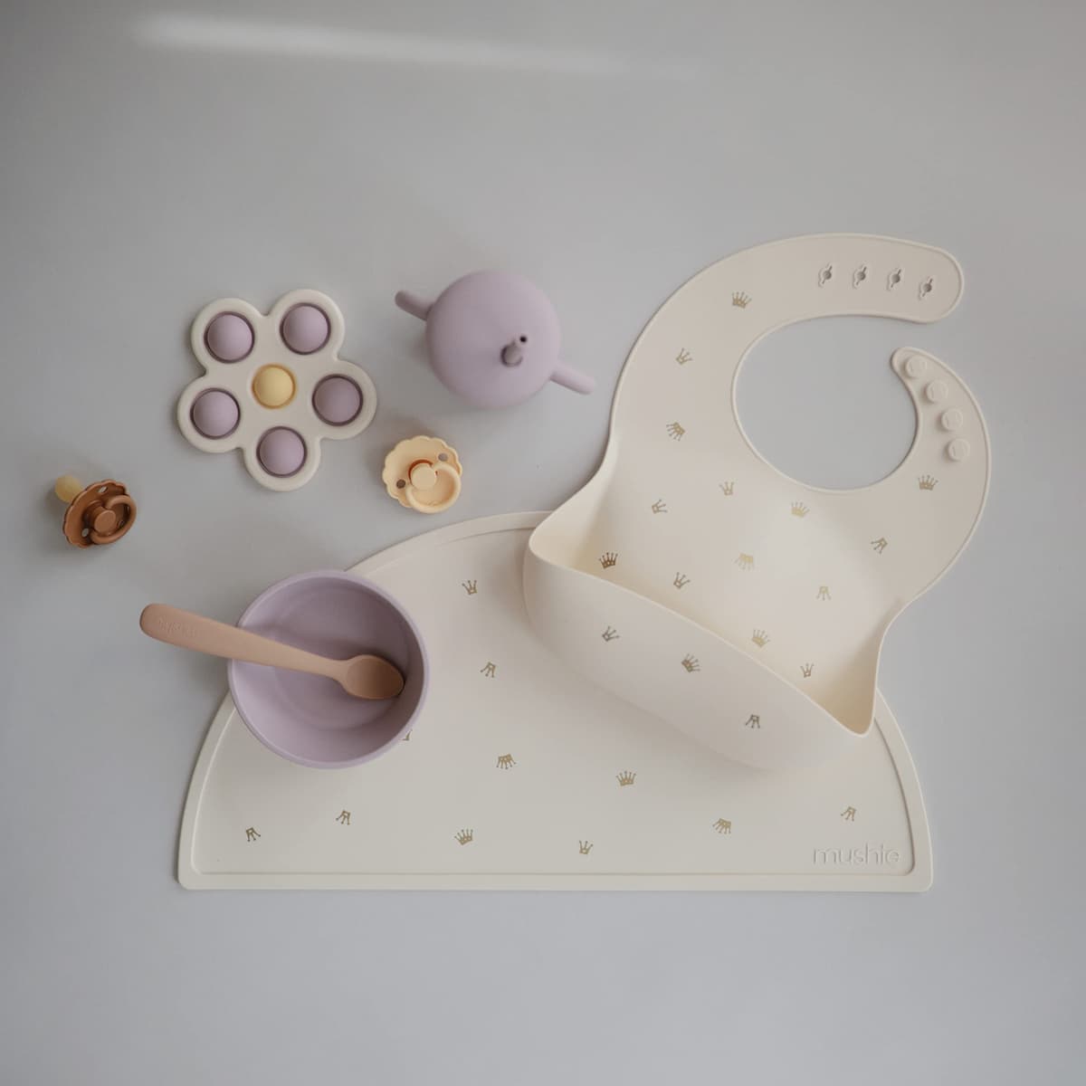 Mushie Baby Silicone Bib | Adjustable Fit Waterproof Bibs | Easy Wipe Baby Feeding Bibs | 4 Adjustable Sizes with Deep Front Pockets | 100% BPA and Phthalate Free — view 3