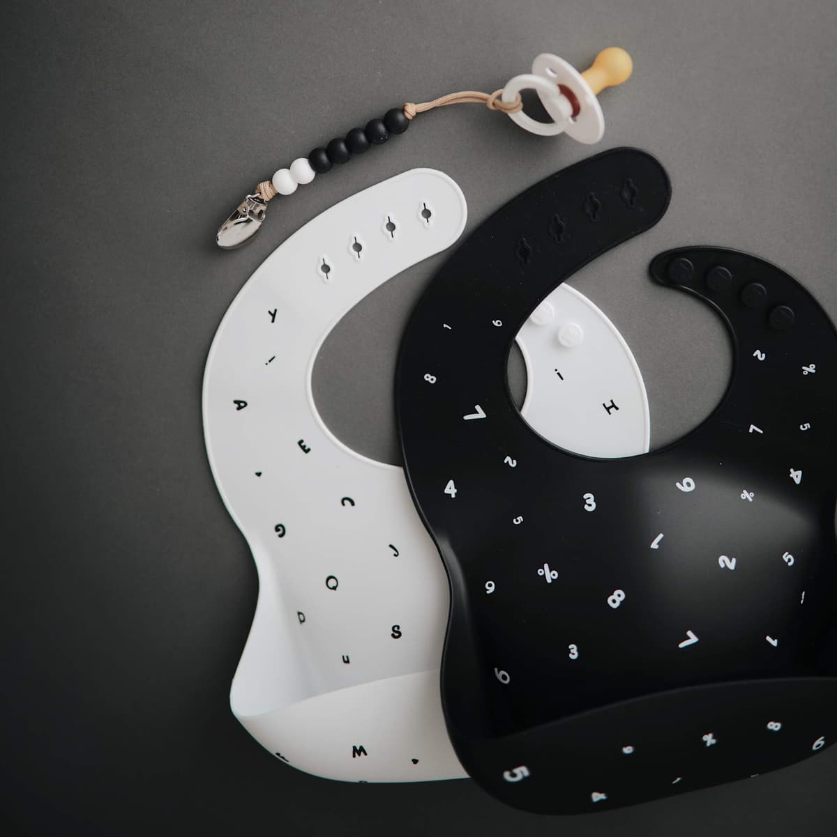 Mushie Baby Silicone Bib | Adjustable Fit Waterproof Bibs | Easy Wipe Baby Feeding Bibs | 4 Adjustable Sizes with Deep Front Pockets | 100% BPA and Phthalate Free — view 7