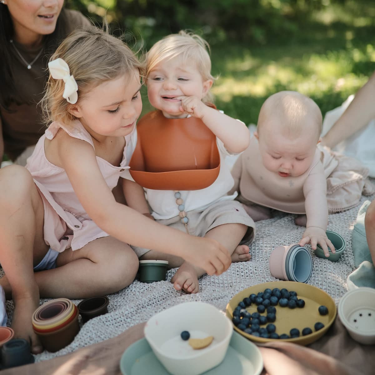 Mushie Baby Silicone Bib | Adjustable Fit Waterproof Bibs | Easy Wipe Baby Feeding Bibs | 4 Adjustable Sizes with Deep Front Pockets | 100% BPA and Phthalate Free — view 5